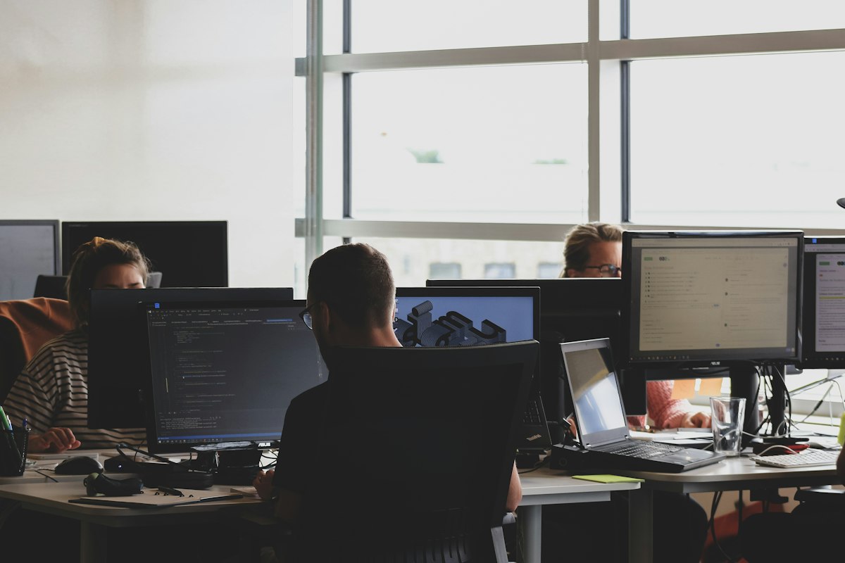 Developer working at a dual-monitor setup