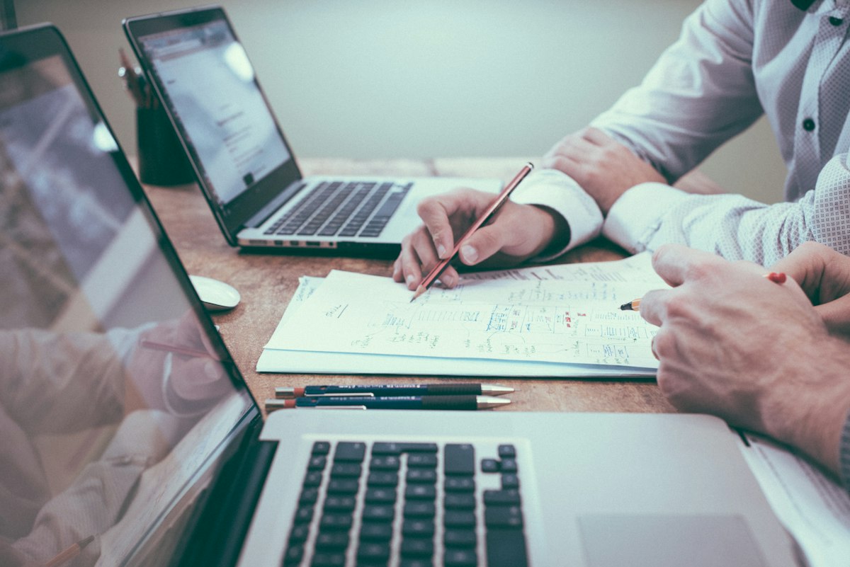 Business owner and consultant reviewing a plan together